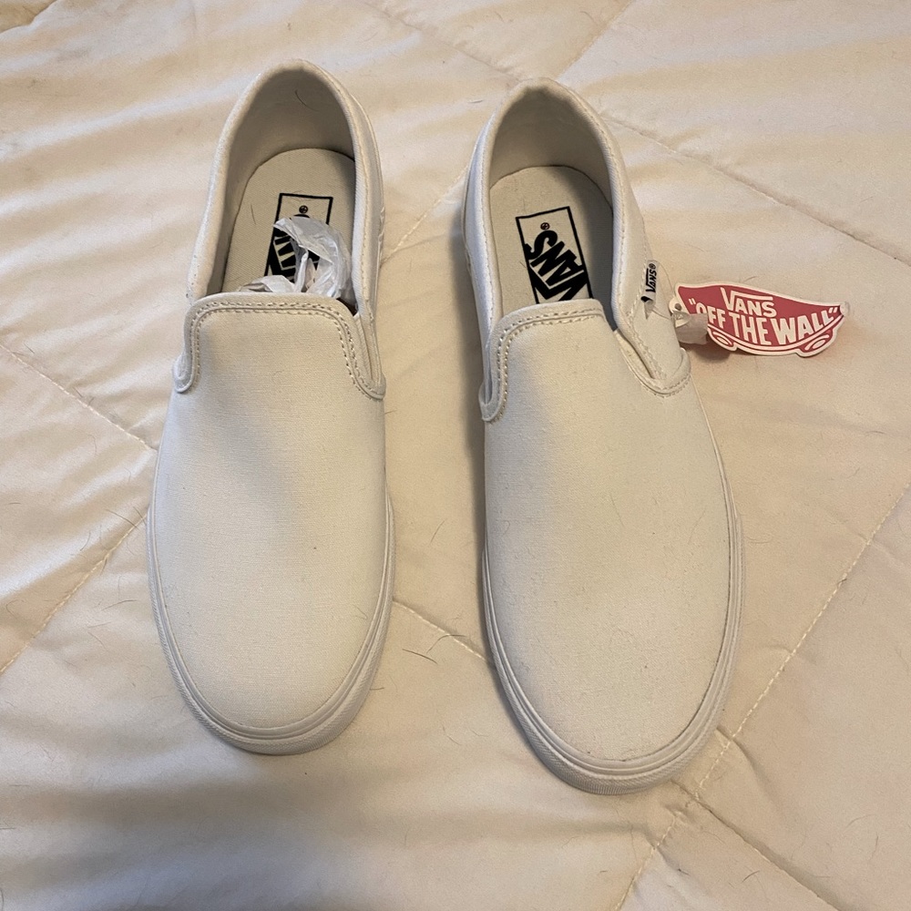 Brand new women’s vans white slip ons 9.5